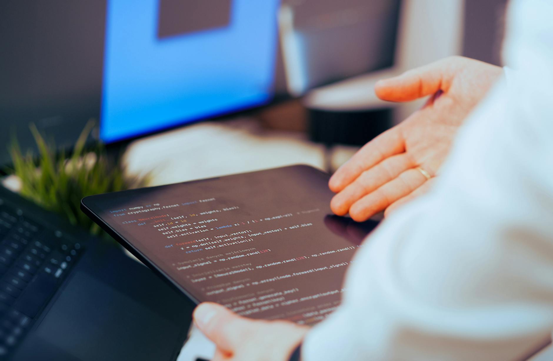 Person Holding Black Ipad